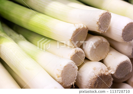 Stack of leeks, staple food in cuisine, natural produce packed with flavor Stack of leeks, staple food in cuisine, natural produce packed with flavor 113728710