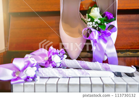 bride's shoes on the piano, bride's bouquet. wedding attributes. 113730132