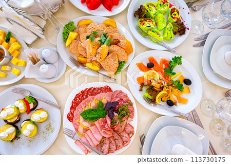 meal at the banquet. good cuts of meat, cheese. the holiday table meal at the banquet. good cuts of meat, cheese. the holiday table 113730175