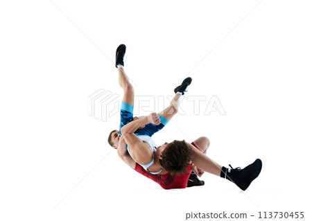 Male wrestlers involved in intense competition, each fighting to assert dominance isolated on white background 113730455