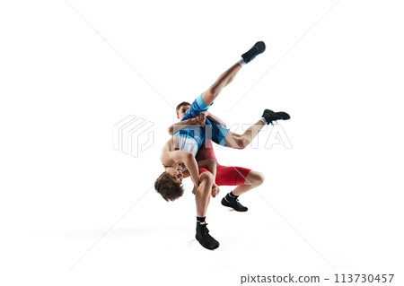 Young male athletes compete in a wrestling match, displaying skill and strategy in training session, isolated on white background 113730457