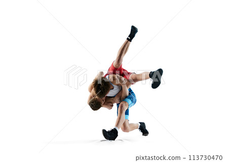 Male wrestlers compete in intense poses, displaying athletic skills, training isolated on white background 113730470