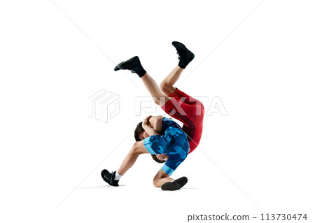 Male wrestlers display power and technique during competition wrestling round isolated on white background 113730474