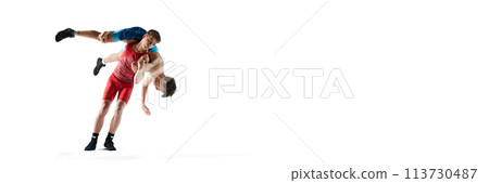 Young male athletes engage in physical contest, wrestling with determination and focus isolated on white background. Banner 113730487