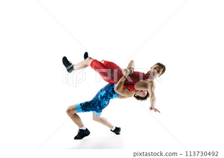 Young boys, athletes wrestling, training, displaying skill and strategy for victory, isolated on white background 113730492