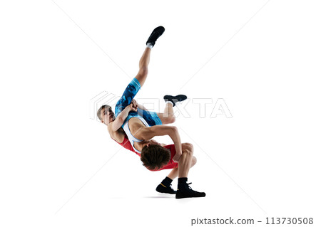 Young men, athletes wrestling with intensity and focus, aiming for victory in their match isolated on white background 113730508