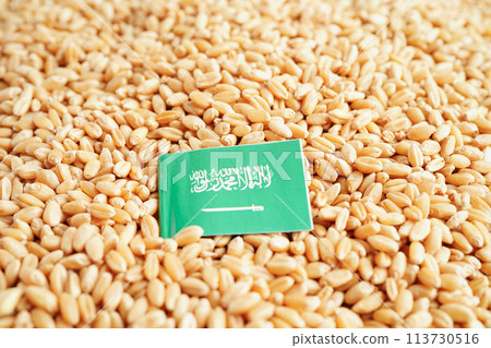Saudi Arabia flag on grain wheat, trade export and economy concept. 113730516