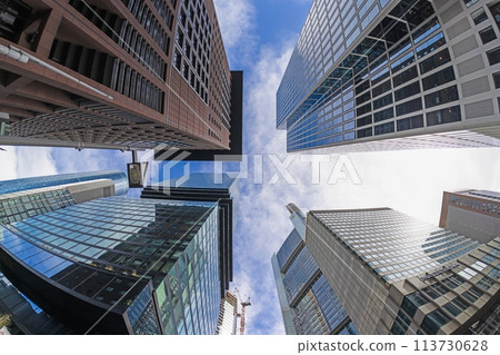 Image of the Frankfurt skyline taken vertically upwards against a blue sky Image of the Frankfurt skyline taken vertically upwards against a blue sky 113730628