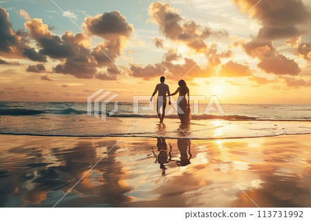 Young romantic couple walking down a beach towards the picturesque sunset. Full body back of couple hug in evening on holiday by sea. Summer vacation and weekend by ocean. Man and woman holding hands. 113731992
