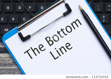 Clipboard with the bottom line text with pen and keyboard on wooden desk. Clipboard with the bottom line text with pen and keyboard on wooden desk. 113732458