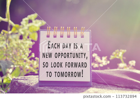 Motivational and inspirational quote on stand paper with beautiful sun ray. Motivational and inspirational quote on stand paper with beautiful sun ray. 113732894
