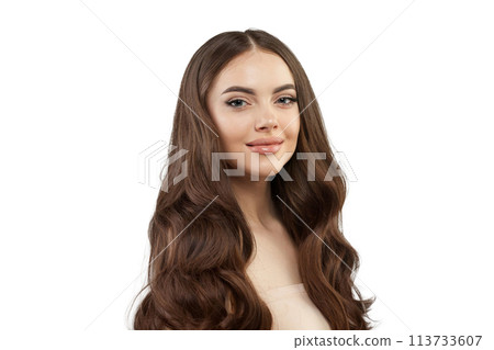 Cheerful young female model with healthy hair, makeup and shiny clear skin posing  113733607