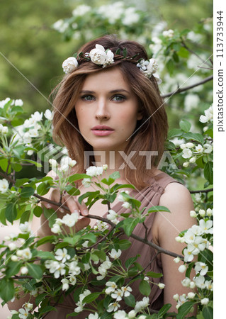Gorgeous lady female model in spring leaves background 113733944