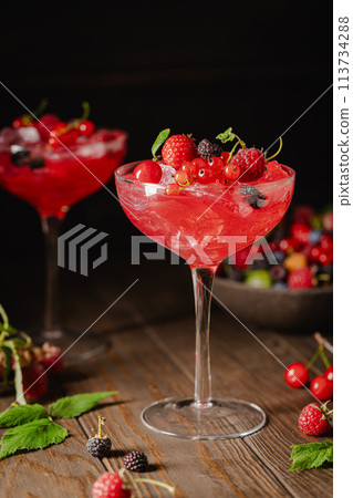 Glass of berry cocktail 113734288