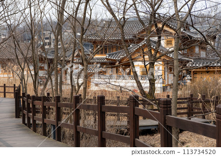 Wooden path in Eunpyeong Hanok Village, the largest neo-hanok residential complex in the capital area which surrounded by hills and mountains in Seoul, South Korea 113734520