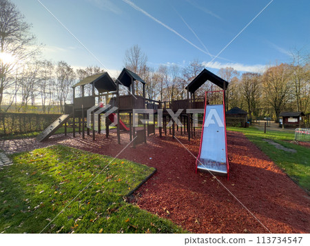 Colorful playground on yard in the park. Colorful playground on yard in the park. 113734547