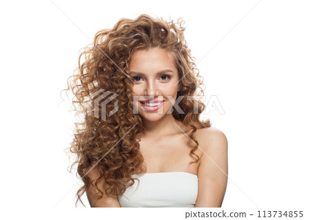 Positive young healthy lady portrait. Perfect woman with long frizzy hairstyle, natural makeup  113734855