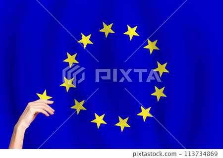 European Union flag and hand with star. EU concept 113734869