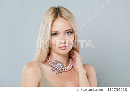Smiling fashion model woman with clear fresh perfect skin and long blonde hair  Smiling fashion model woman with clear fresh perfect skin and long blonde hair  113734918