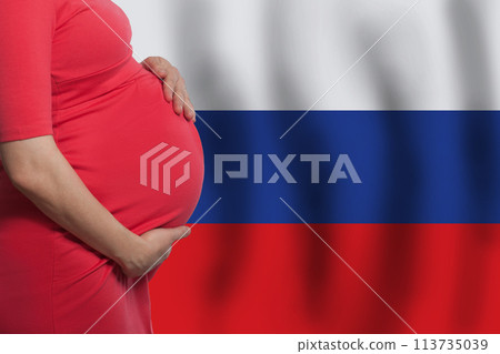 Pregnant woman belly on Russian flag background 113735039