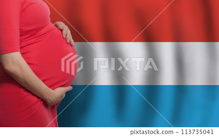 Pregnant woman belly on flag of Grand Duchy of Luxembourg background 113735041