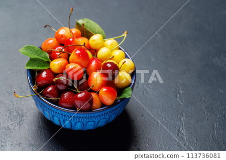 A vibrant and colorful cherry, bursting with sweet juiciness A vibrant and colorful cherry, bursting with sweet juiciness 113736081