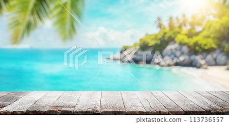 Empty wooden table or pier with sunny beach and sea 113736557