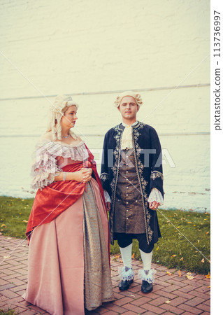 Portrait of blonde woman and man dressed in historical Baroque clothes Portrait of blonde woman and man dressed in historical Baroque clothes 113736997