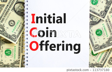 ICO initial coin offering symbol. Concept words ICO initial coin offering on beautiful white note. Beautiful dollar bills background. Business ICO initial coin offering concept. Copy space. 113737180