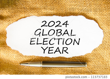 2024 global election year symbol. Concept words 2024 global election year on beautiful white paper. Beautiful canvas background. Black pen. Business 2024 global election year concept. Copy space 2024 global election year symbol. Concept words 2024 global election year on beautiful white paper. Beautiful canvas background. Black pen. Business 2024 global election year concept. Copy space 113737183