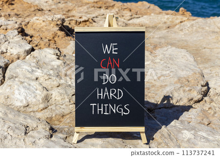 We can do hard things symbol. Concept words We can do hard things on beautiful blackboard. Beautiful stone sea background. Business, we can do hard things concept. Copy space. We can do hard things symbol. Concept words We can do hard things on beautiful blackboard. Beautiful stone sea background. Business, we can do hard things concept. Copy space. 113737241