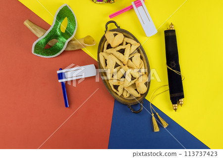 Purim is Jewish festival of remembrance, which is celebrated with carnival mask a hamantaschen cookies Purim is Jewish festival of remembrance, which is celebrated with carnival mask a hamantaschen cookies 113737423