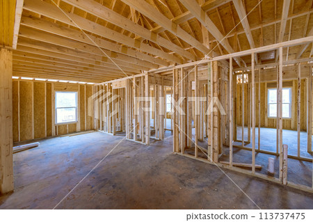 View beams stick framing of a house on new home construction View beams stick framing of a house on new home construction 113737475
