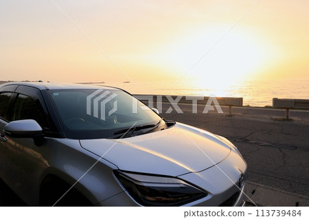 A car bathed in the morning sun after being washed 113739484