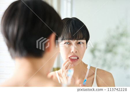 Women who are concerned about swollen gums 113742228
