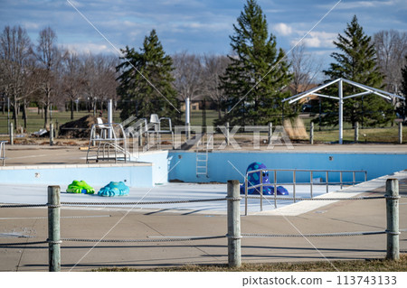drained and empty public pool for winterization in the fall. 113743133