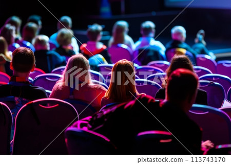 Audience members at a vibrant presentation event Audience members at a vibrant presentation event 113743170