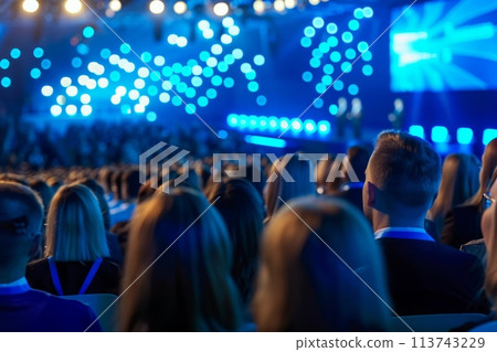 Audience attentively listening at a corporate event 113743229
