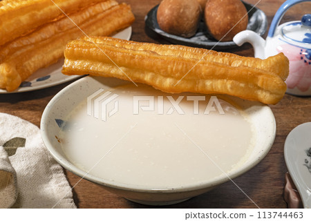 Almond drink and fried dough sticks Almond drink and fried dough sticks 113744463