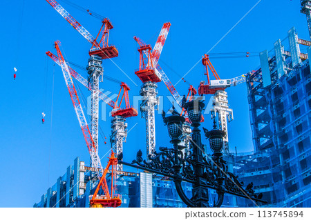 Tokyo cityscape in April. View of the redevelopment project in Nihonbashi 1-chome and pigeons = April 19, 2024 Tokyo cityscape in April. View of the redevelopment project in Nihonbashi 1-chome and pigeons = April 19, 2024 113745894