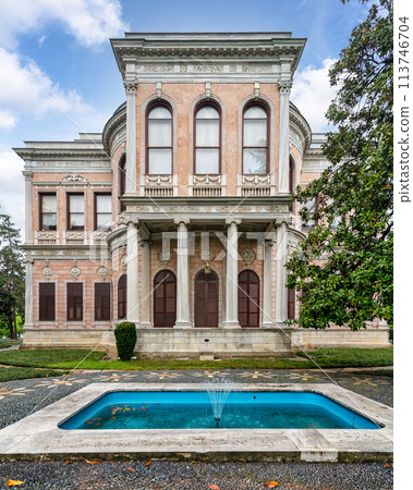 Historic Ottoman 19th century Mecidiye Pavilion, located in Beykoz, Istanbul, Turkey, with a large fountain in front 113746704