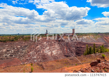View of huge iron ore quarry in Kryvyi Rih, Ukraine. Open pit mining View of huge iron ore quarry in Kryvyi Rih, Ukraine. Open pit mining 113747415