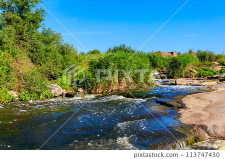 View of Tokovsky waterfalls on the Kamenka river in Dnipropetrovsk region, Ukraine 113747430