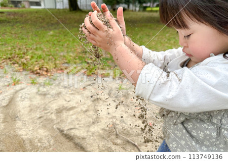 Children playing in the sandbox Children playing in the sandbox 113749136