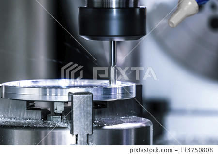 Lathe milling metal in industry. Process of machining a metal part Lathe milling metal in industry. Process of machining a metal part 113750808