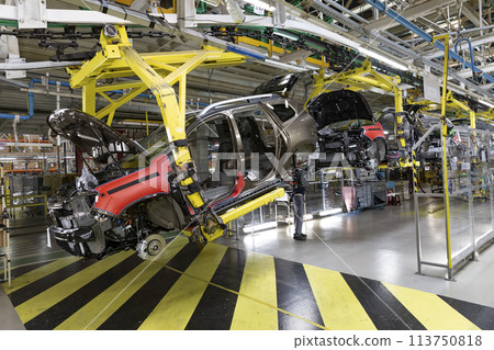 Industrial production of car automobiles. Plant for assembling modern cars on an assembly line. Industry, production, industry concept. 113750818