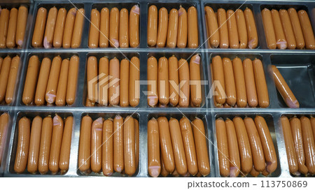 Production of meat sausages. Meat factory and industry. 113750869