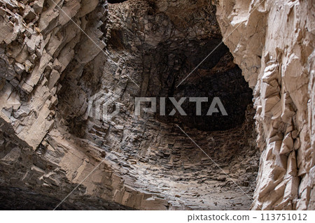 A cave formed in bedrock with a central hole caused by erosion. Ashabi-Kahf in Nakhchivan. A cave formed in bedrock with a central hole caused by erosion. Ashabi-Kahf in Nakhchivan. 113751012