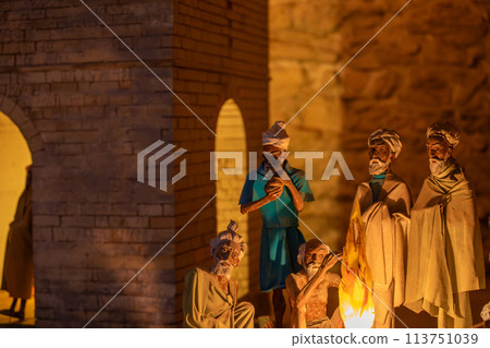 People gathering outside a historic brick building for a cultural event People gathering outside a historic brick building for a cultural event 113751039