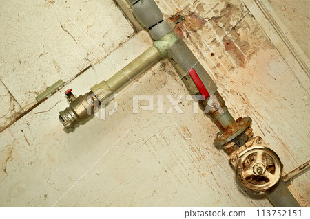 Plumbing. Sewerage. Water valve shutting off the water tap in the basement Plumbing. Sewerage. Water valve shutting off the water tap in the basement 113752151